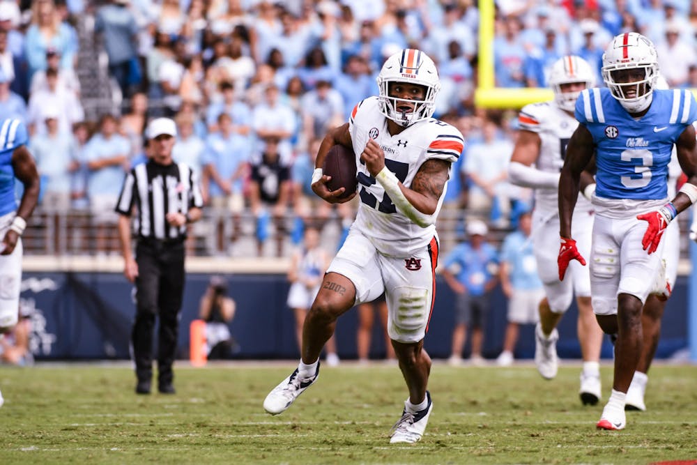 <p>Auburn running back Jarquez Hunter (27) bursts through the line for a 48-yard rush against the Ole Miss Rebels in the second quarter at Vaught-Hemingway Stadium on Oct. 15, 2022.</p>