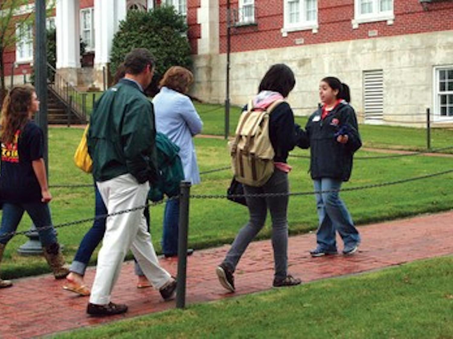 Amanda Baldonado, a junior in HDFS, shows prospective students around the Auburn campus.
