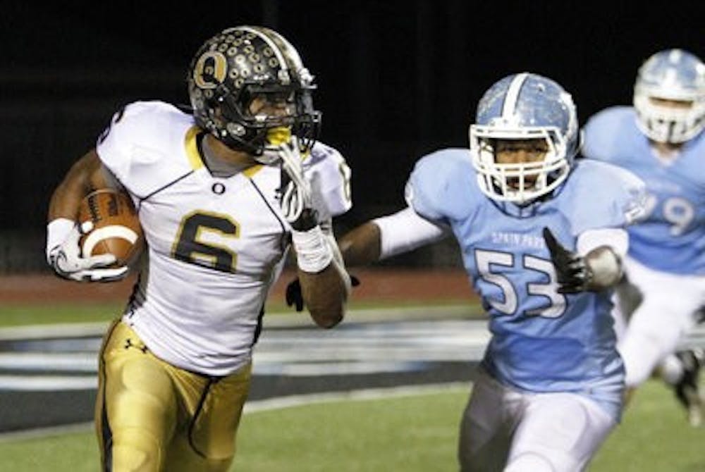 Auburn signee Racean "Roc" Thomas carries the ball for the Oxford Yellow Jackets against Spain Park High School (Contributed by AL.com)