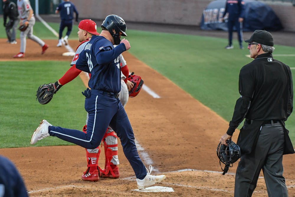 Auburn first baseman Cooper McMurray (26) runs home during the home opener against Indiana in Plainsman Park on Feb. 17, 2023.