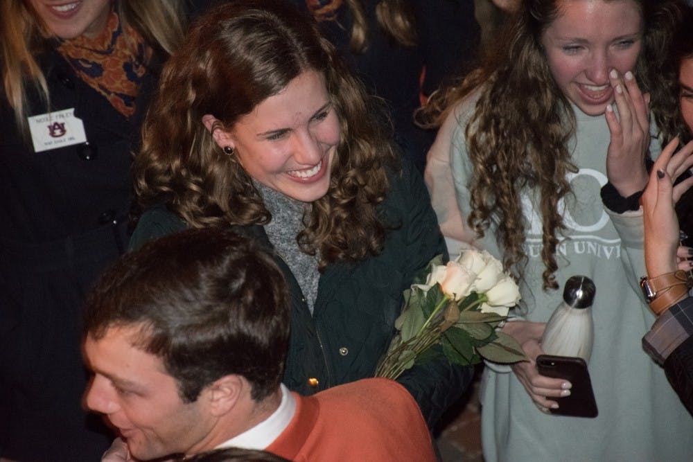<p>Kathryn Kennedy holds flowers after learning she will be the newest Miss Auburn on Tuesday, Feb. 6, 2018, in Auburn, Ala.</p>