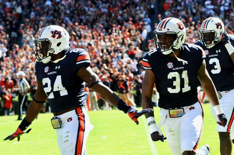 daniel thomas (24), chandler wooten (31) and marlon davidson (3)