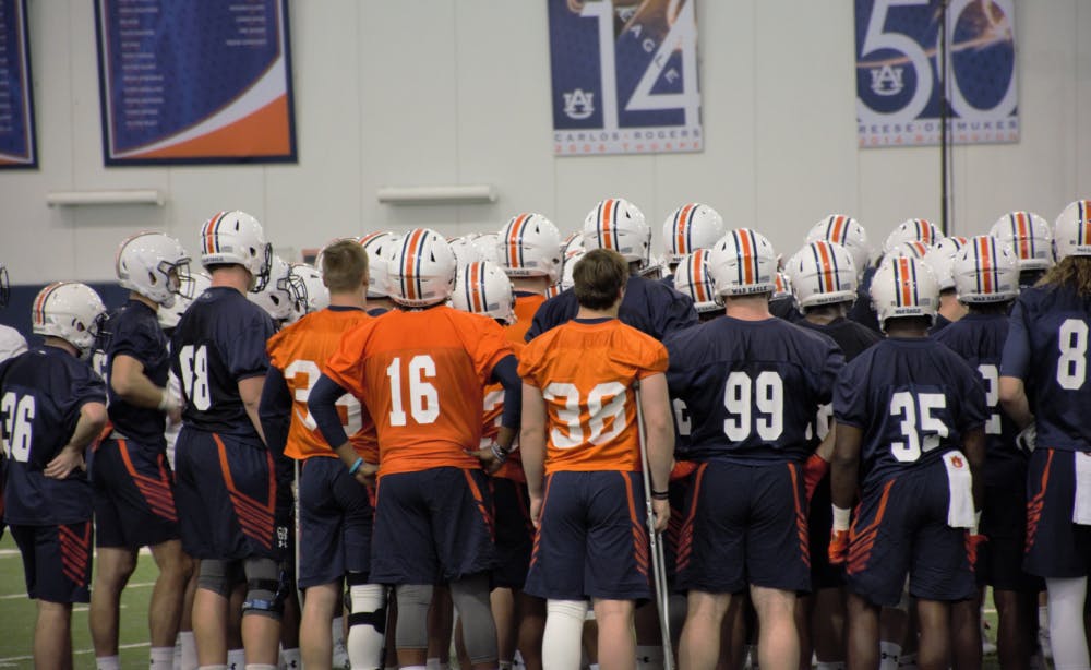 The Auburn football team huddles&nbsp;during Auburn football spring practice on March 1, 2018 in Auburn, Ala.