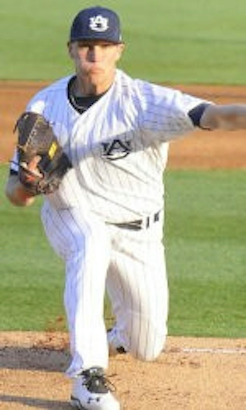 Michael O'Neal rounding out a pitch against Georgia. (Courtesy of Auburn Athletics)