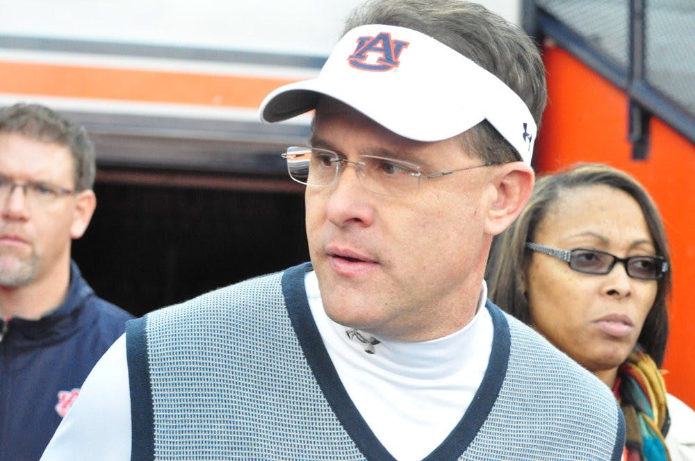 Head Coach Guz Malzahn enters the field before Saturday's Iron Bowl. Anna Grafton / PHOTO EDITOR