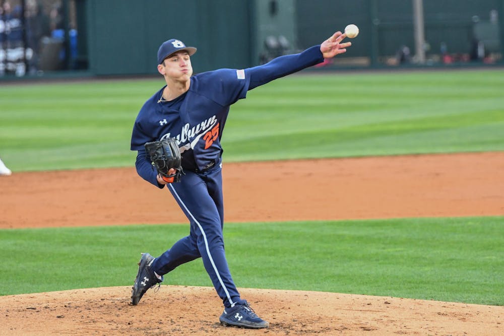 An Auburn pitcher throws the ball during the home opener against Indiana in Plainsman Park on Feb. 17, 2023.