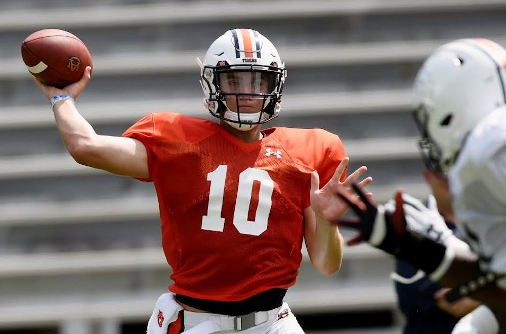 <p>Bo Nix (10) aims to throw during an Auburn scrimmage at fall camp.</p>