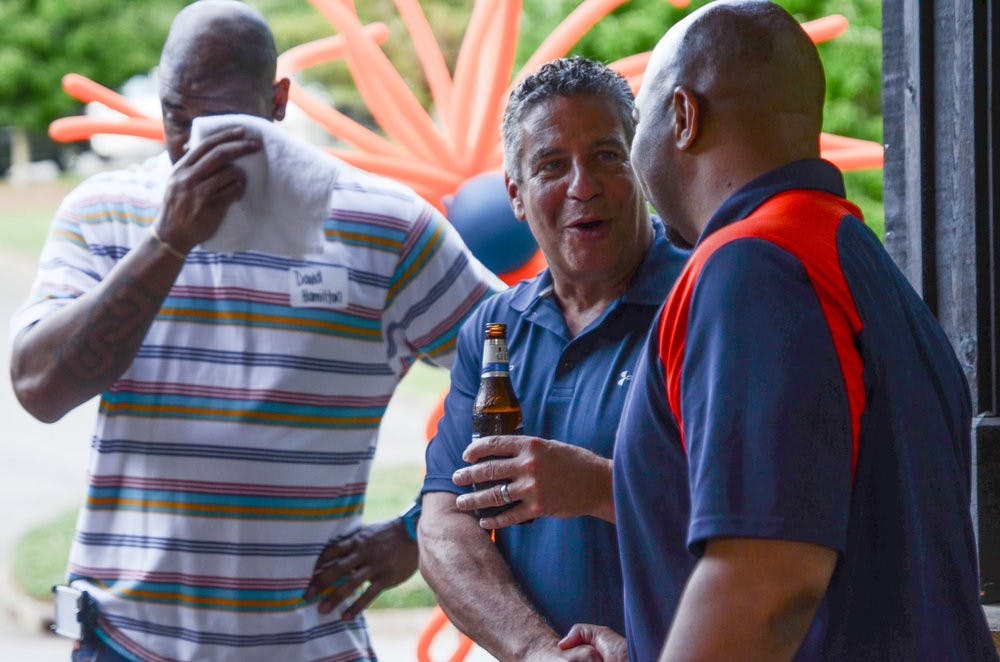 Head basketball coach Bruce Pearl greets former players, coaches and their families at the entrance of the Letterman Reunion.

Raye May / PHOTO & DESIGN EDITOR