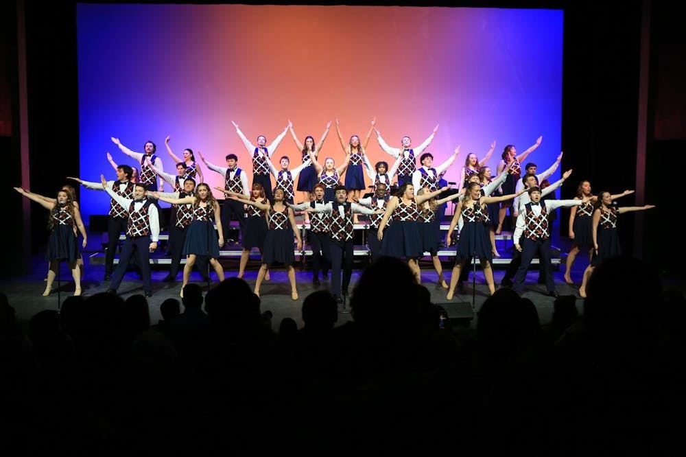<p>The AU Singers strike a pose at the end of "Eye of the Tiger" during their fall show in 2025. Contributed by Parker Ragsdale.</p>
