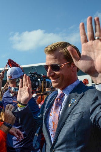 Rhett Lashlee high-fives fans at Tiger Walk at Kansas State. (FILE PHOTO)