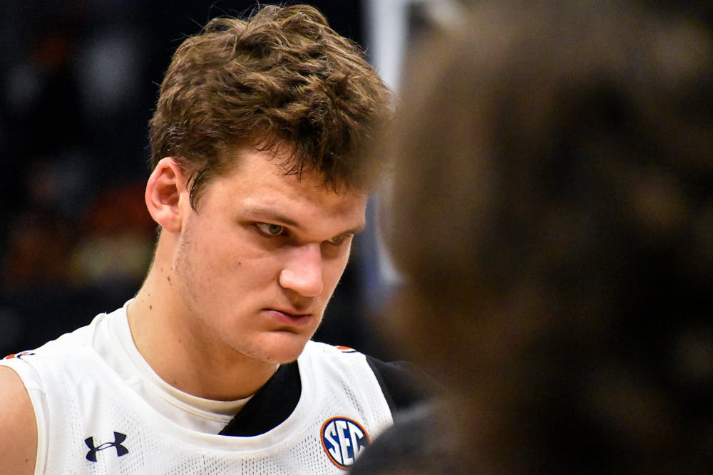 <p>Walker Kessler (13) looks on during the post-game huddle after a match between Auburn and Texas A&amp;M in the SEC Tournament in Tampa, Florida, on March. 11, 2022.</p>