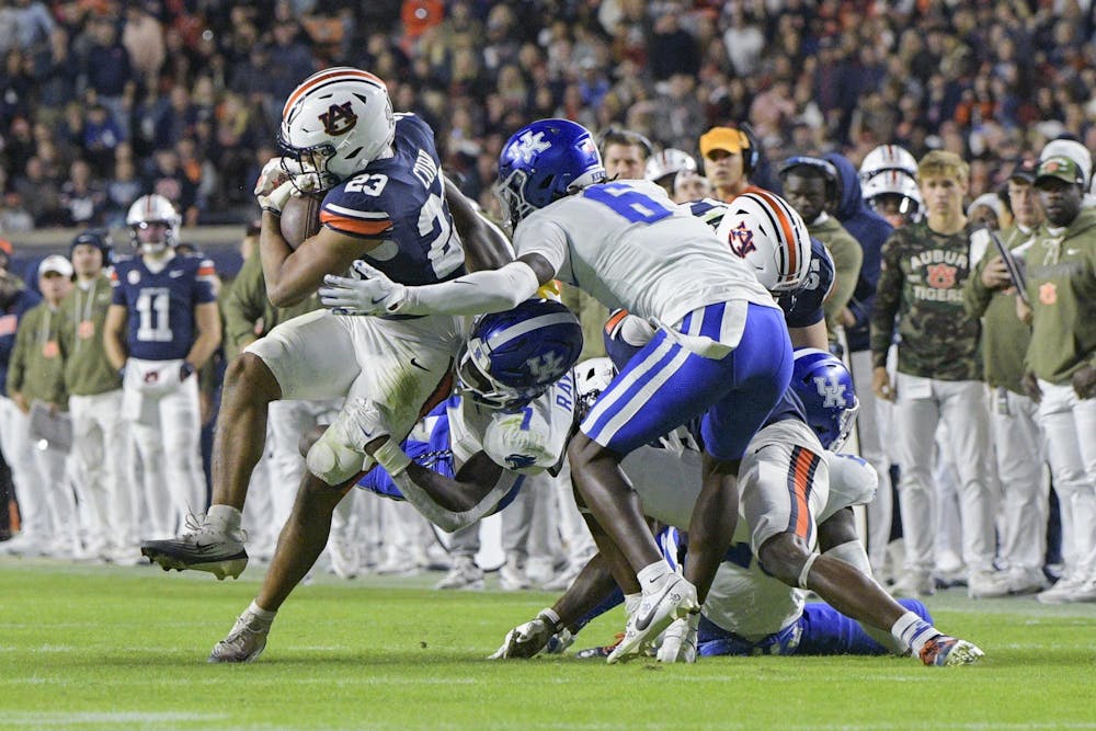 Auburn Running Back Jeremiah Cobb (23) pushes past Kentucky defense during a matchup against the Kentucky Wildcats in Jordan-Hare Stadium on Nov. 1, 2025.