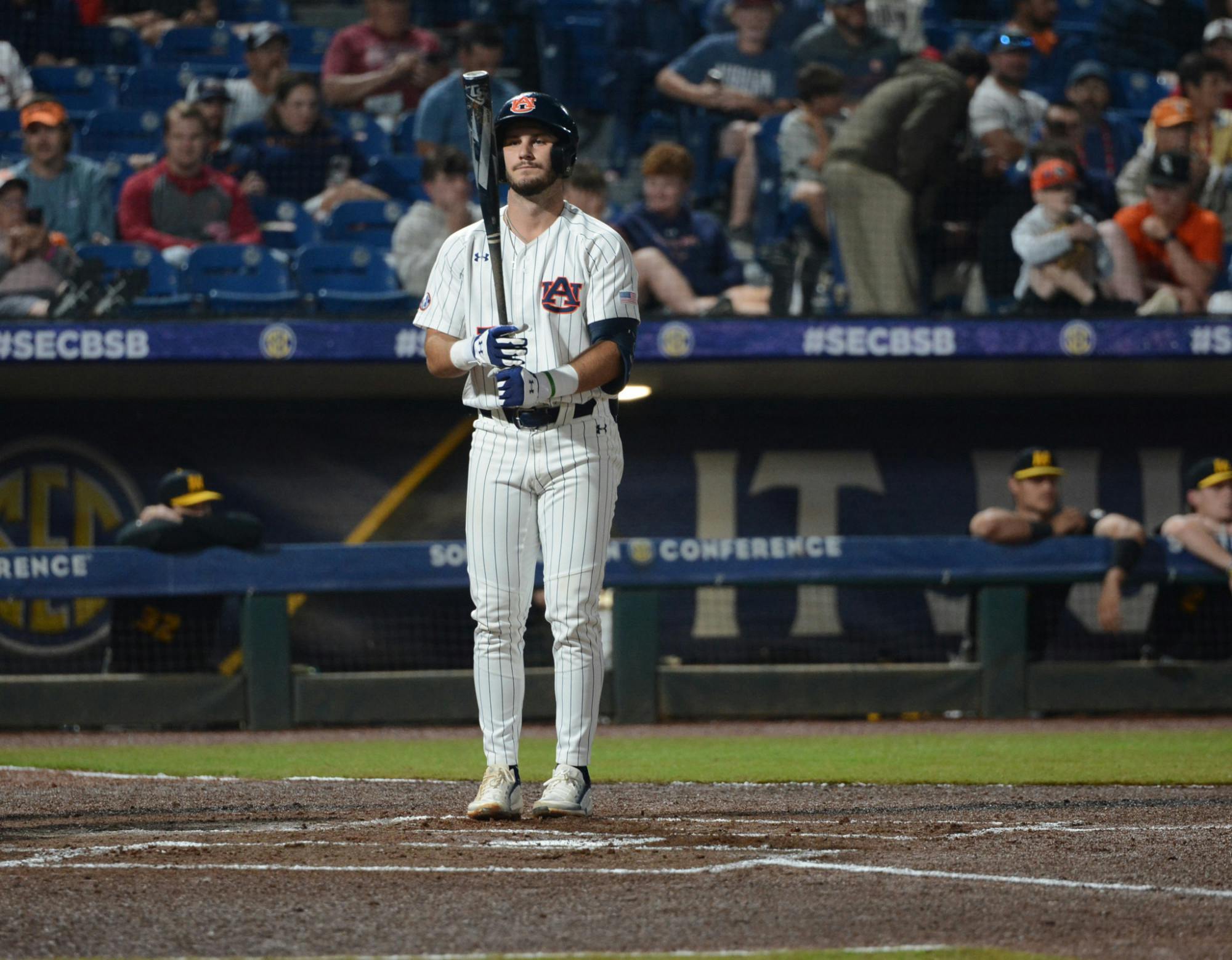 Cole Foster looks at bat.jpg