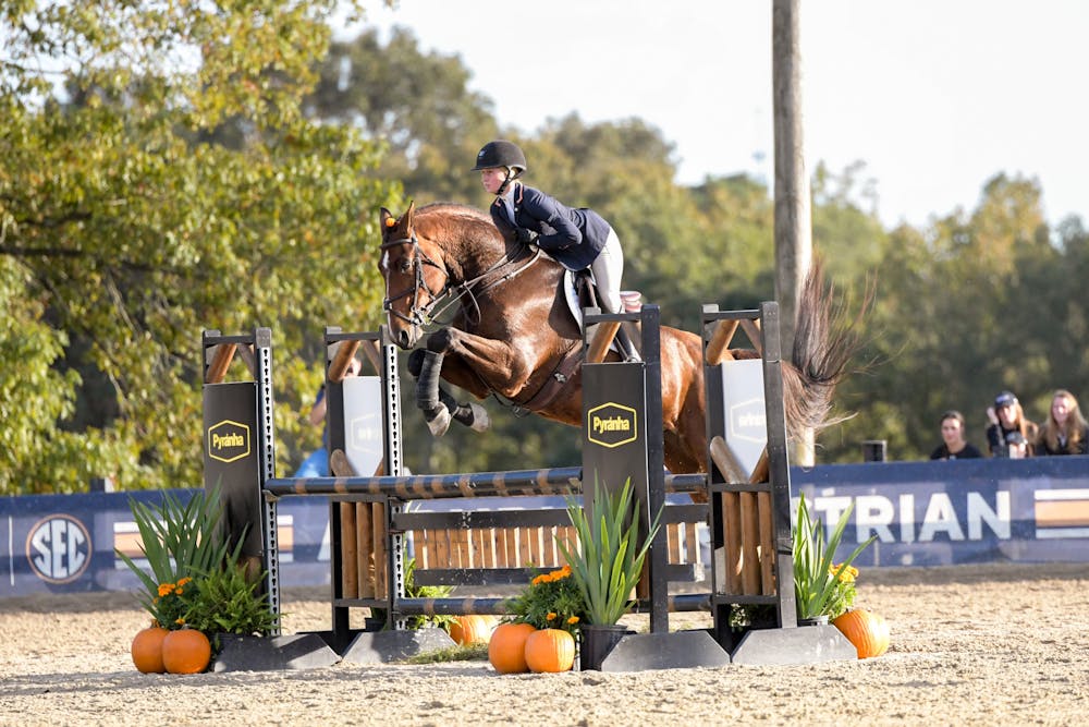 Sophee Steckbeck jumping Blue over fence in a meet against South Carolina at Auburn Equestrian Center on Oct. 27, 2023