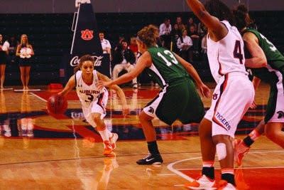 Junior guard Najat Oaurdad weaves through University of South Carolina Upstate defenders in Auburn's 75-34 rout of the Spartans Sunday. (Alex Sager / ASSOCIATE PHOTO EDITOR)