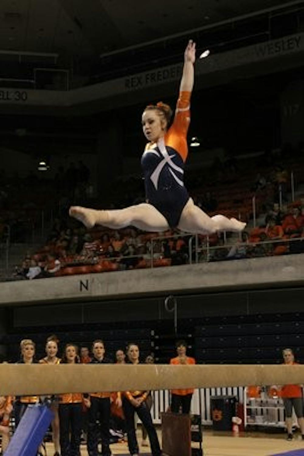Caitlyn Atkinson performs her balance beam routine against Arkansas Friday, Feb. 8. (Courtesy of Todd Van Emst)