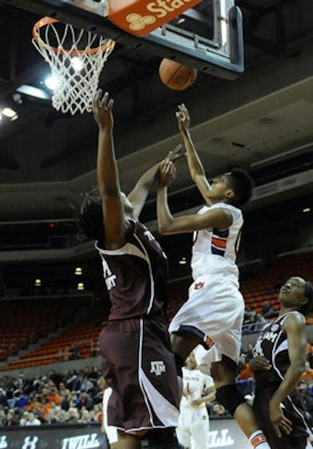 Auburn's Hasina Muhammad shoots over Texas A&M's Karla Gilbert in the first half of their basketball game on Thursday, January 30. (Contributed by Auburn Athletics)