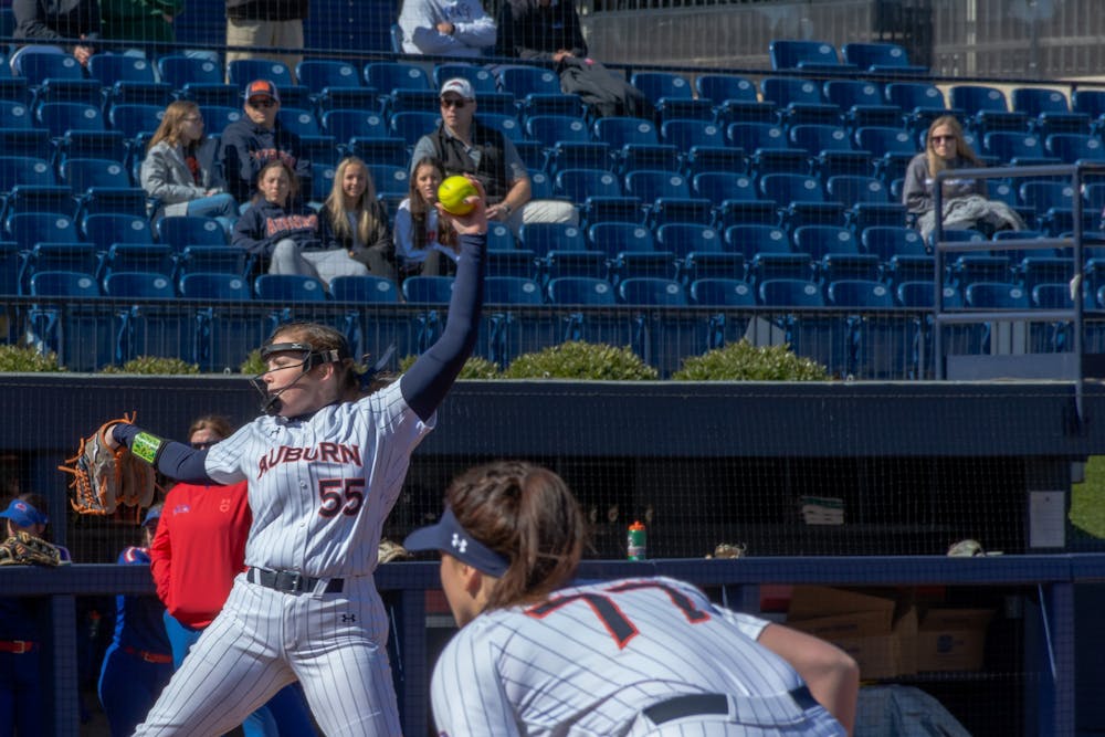 <p>Feb. 13, 2022; Auburn, Ala; Shelby Lowe (55) pitches the ball during a game against UMass Lowell in the Tiger Invitational from Jane B. Moore Field.</p>