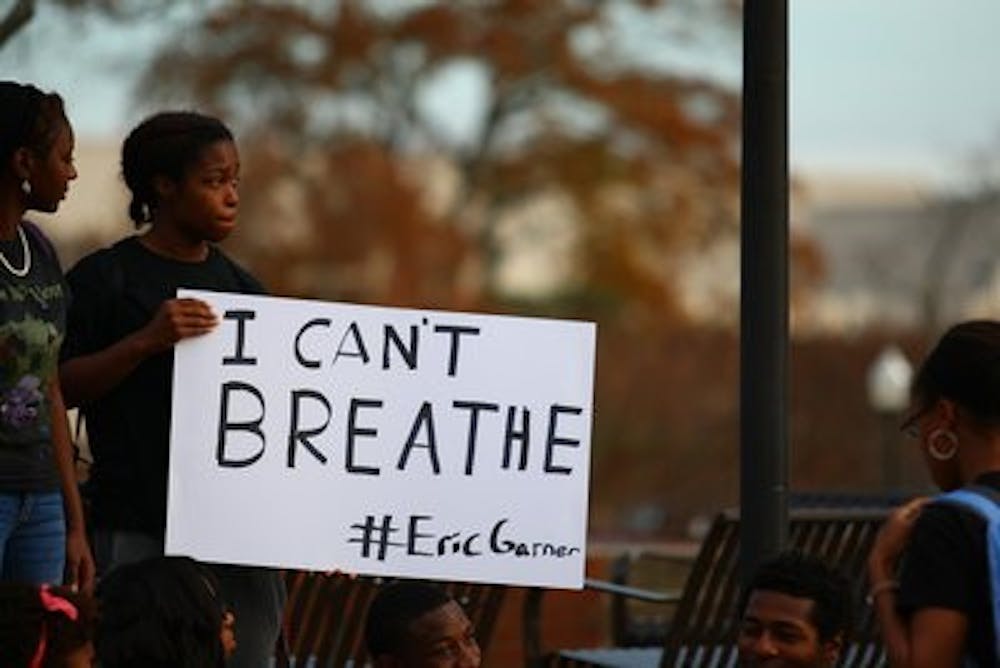 "I thought, 'I need to do something that's not just yelling,'" Grogan-Herod said. "I didn't plan on much, I was just going to sit there with the sign all day. I just wanted to raise awareness." (Kenny Moss l Photographer)