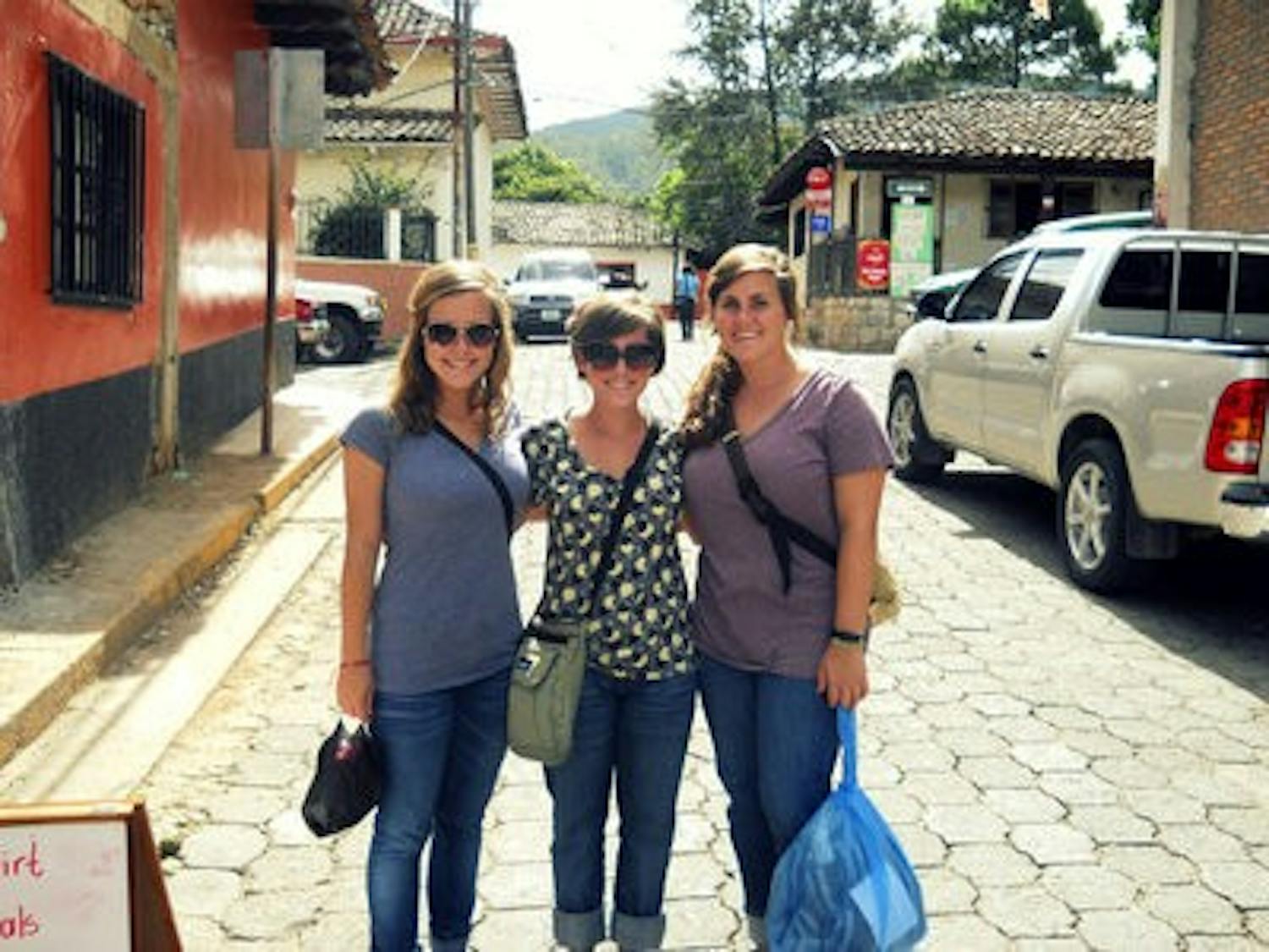 Quadruplets Sarah, Cailtin and Mary Haynes together on their mission trip to Honduras. (CONTRIBUTED)