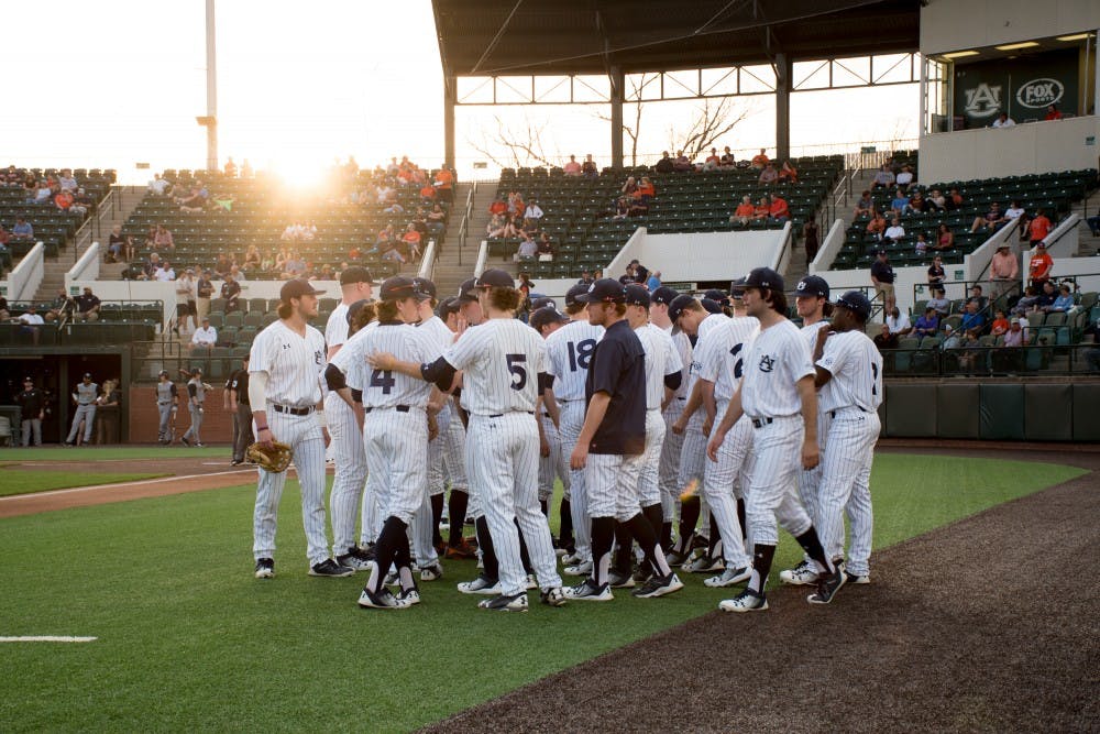 The Auburn baseball team waits for the game to begin on Friday, Feb. 23, 2018, in Auburn, Ala.