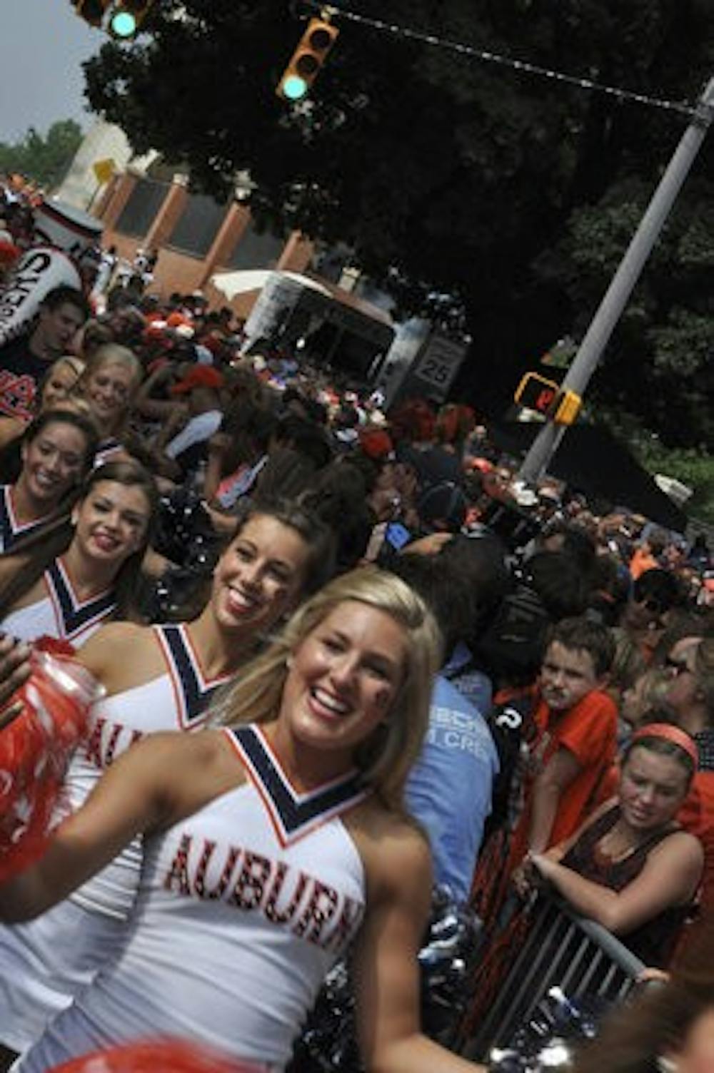 At Tiger Walk, fans and cheerleaders enjoy the atmosphere of anticipation and celebration of Tiger football before the Tigers' win against Washington State Aug. 31. (Anna Grafton / Photo Editor)