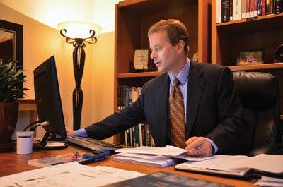 Jeff Deist works in his office. The Institute is home to a wide collection of books which it occasionally lends to the Ralph Brown Draughton Library. (Michael Ontiveros | Photographer)
