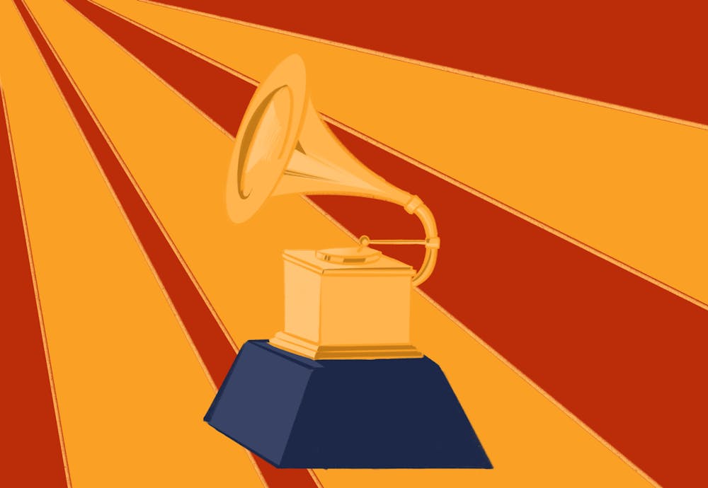 <p>A small golden gramophone stands on a black base, with bright yellow lights shining in the background.</p>
