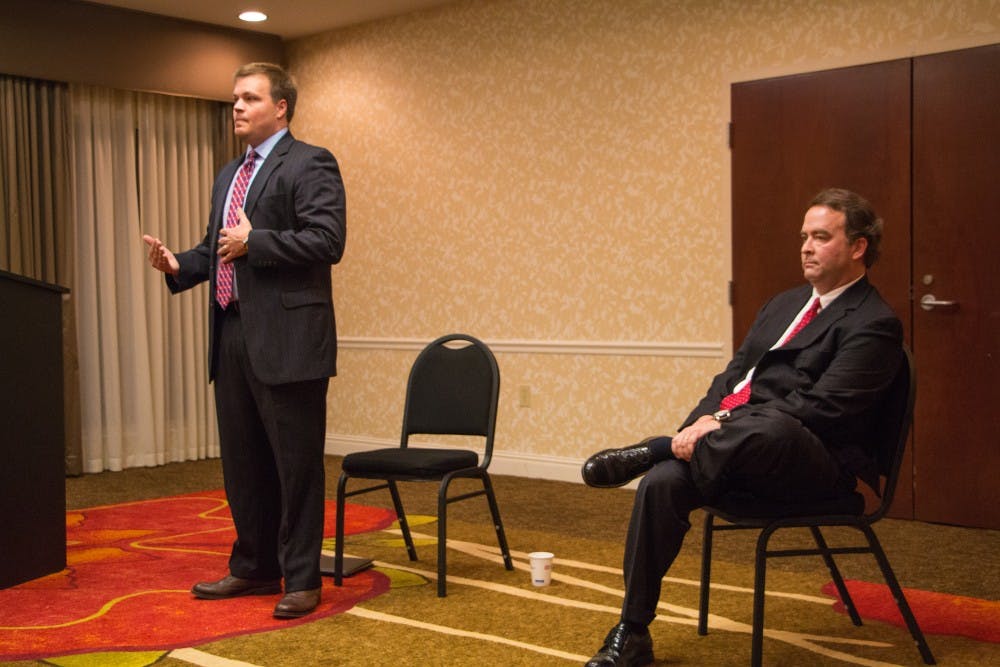 Brandon Hughes and District Attorney&nbsp;Robbie Treese speak to the Lee County Republicans Club at a district attorney candidate forum on Jan. 26, 2016.