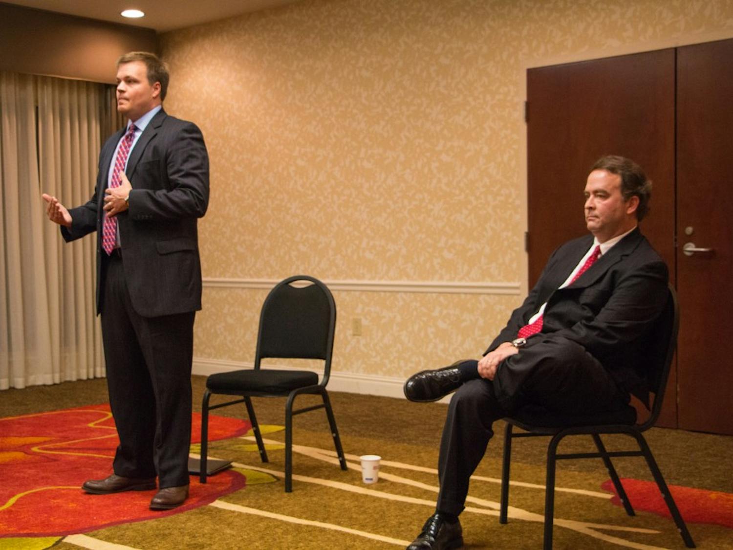 Brandon Hughes and District Attorney&nbsp;Robbie Treese speak to the Lee County Republicans Club at a district attorney candidate forum on Jan. 26, 2016.