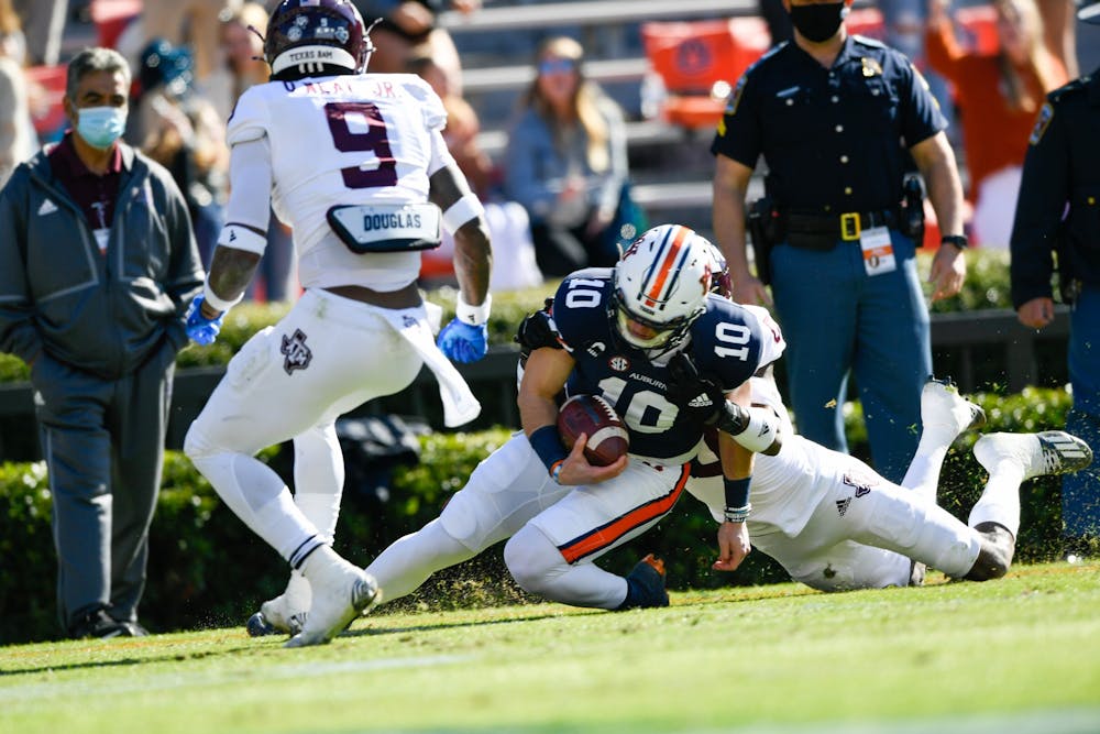 <p>Bo Nix (10) runs for the first down setting up the touchdown during the game between Auburn and Texas A&amp;M at Jordan Hare Stadium on Dec. 5, 2020; Auburn AL, USA. Photo via: Todd Van Emst/AU Athletics</p>
