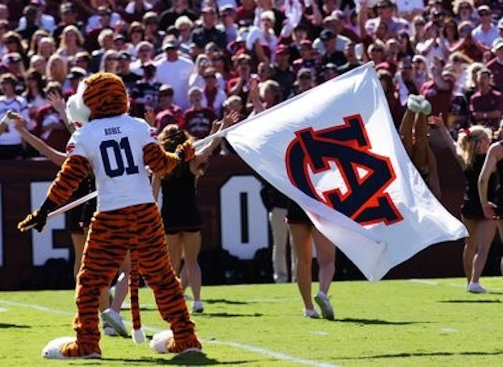 Aubie waves the Auburn flag moments before players run onto the field at Williams Brice stadium in Columbia, S.C. (Robert Lee/Assistant Campus Editor)