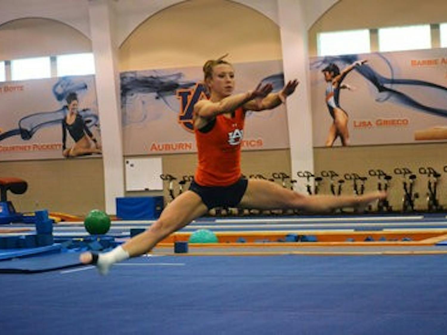 Senior gymnast Laura Lane practices before a meet. In addition to being named to the SEC Community Service Team, Lane also earned her second-straight Scholar-Athlete of the Year honor at the SEC Championships. (Danielle Lowe / ASSISTANT PHOTO EDITOR)