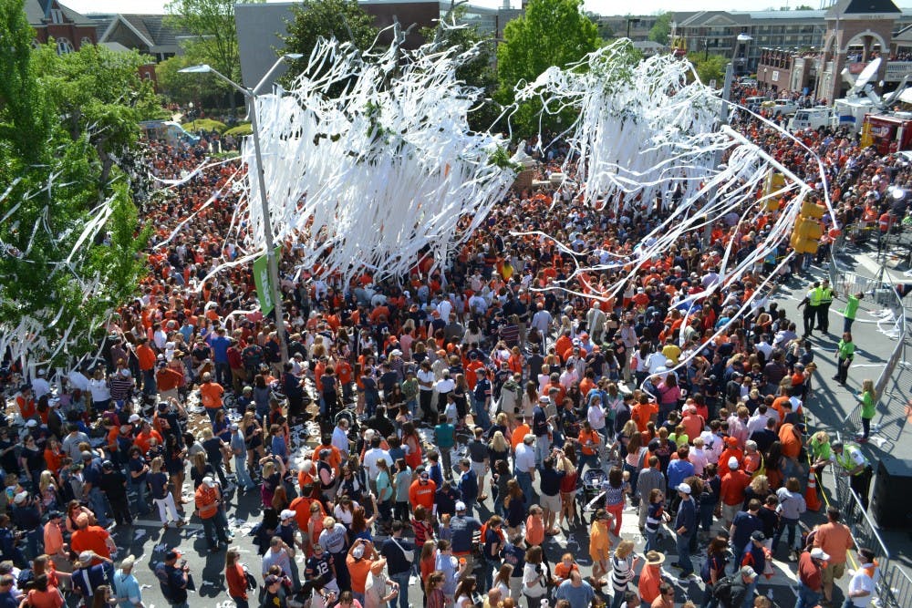 <p>Thousands gathered to roll Toomer's Corner one last time after the 2013 A-Day game. (File Photo)</p>