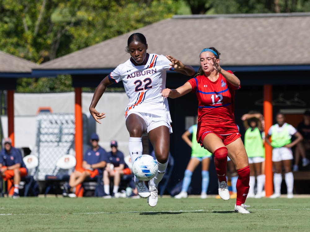 <p>Olivia Woodson handles a pass during American @ Auburn</p>