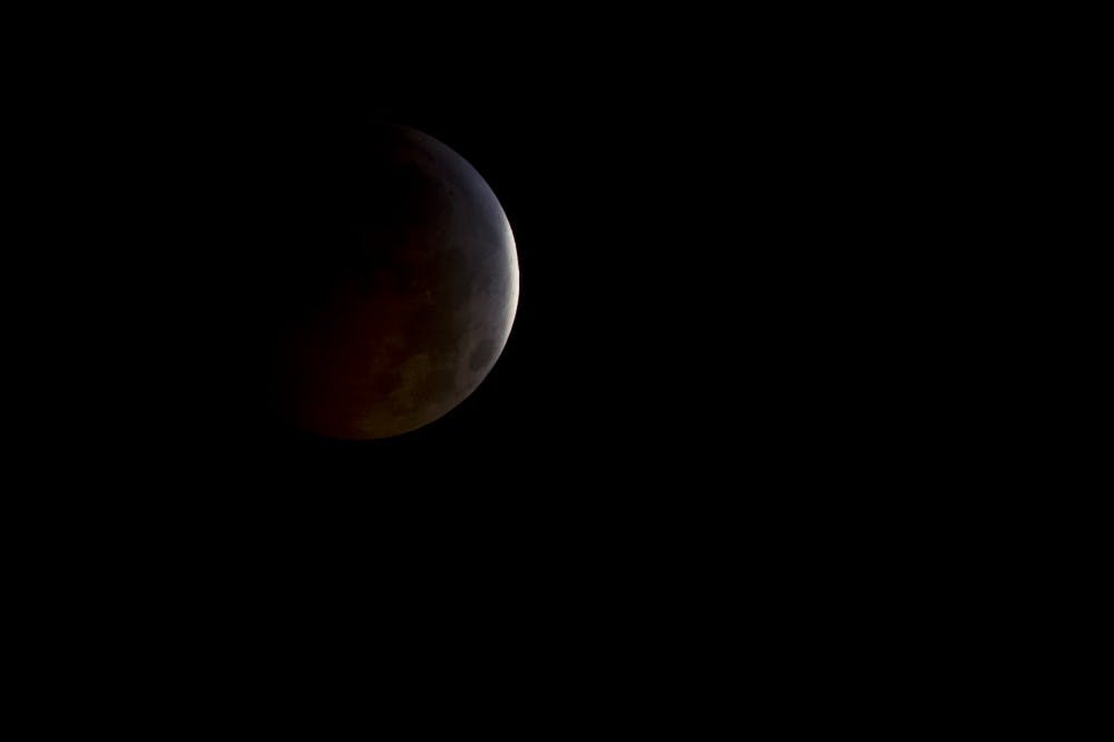 A nearly total lunar eclipse is seen as the full moon is shadowed by the Earth on the arrival of the winter solstice, Tuesday, December 21, 2010 in Arlington, VA.  From beginning to end, the eclipse will last about three hours and twenty-eight minutes.  Photo Credit: (NASA/Bill Ingalls)