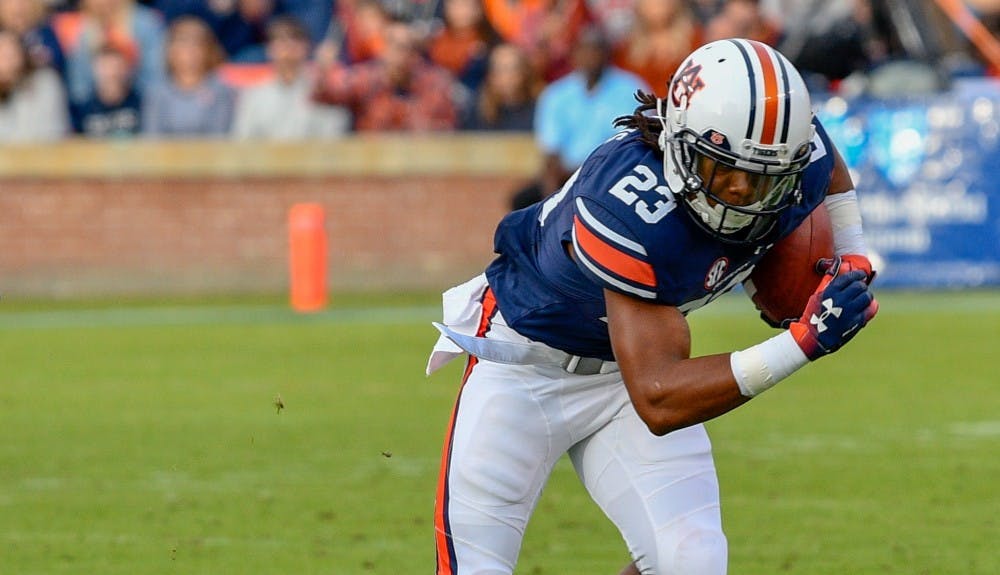 <p>Ryan Davis (23) runs with the ball during Auburn football vs. Liberty on Nov. 17, 2018, in Auburn, Ala.</p>