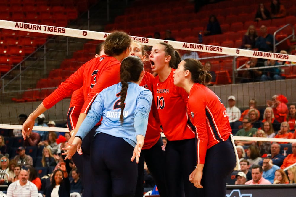 <p>Players huddle together during Auburn volleyball versus Florida at Neville Arena on Oct. 26, 2022.</p>