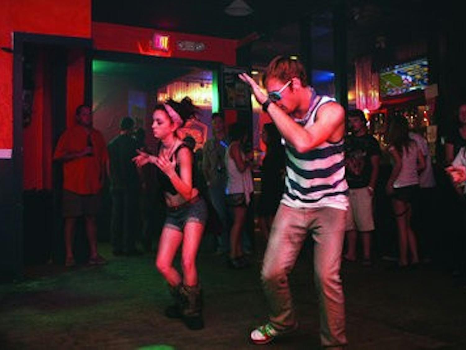 Dancers move to the dubstep beats of DJ Esco at the monthly TKO dance party,  now held at Bourbon Street Bar after the closing of The Independent. (Rebecca Croomes / ASSISTANT PHOTO EDITOR)