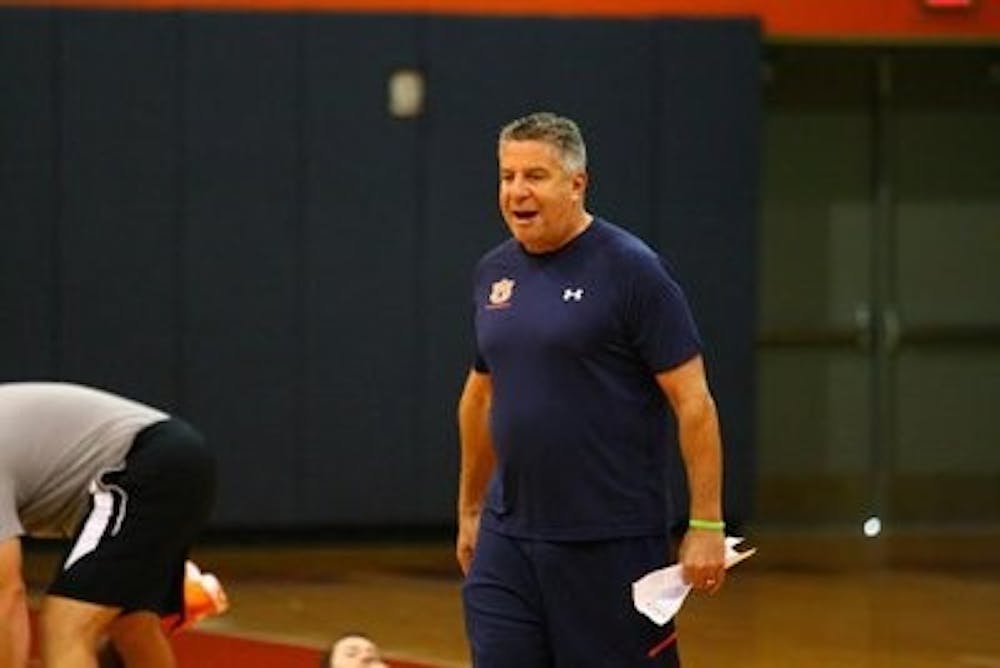 Head basketball coach Bruce Pearl coaches during the team's first practice on Friday, Oct. 3, 2014. (Kenny Moss / Photographer)