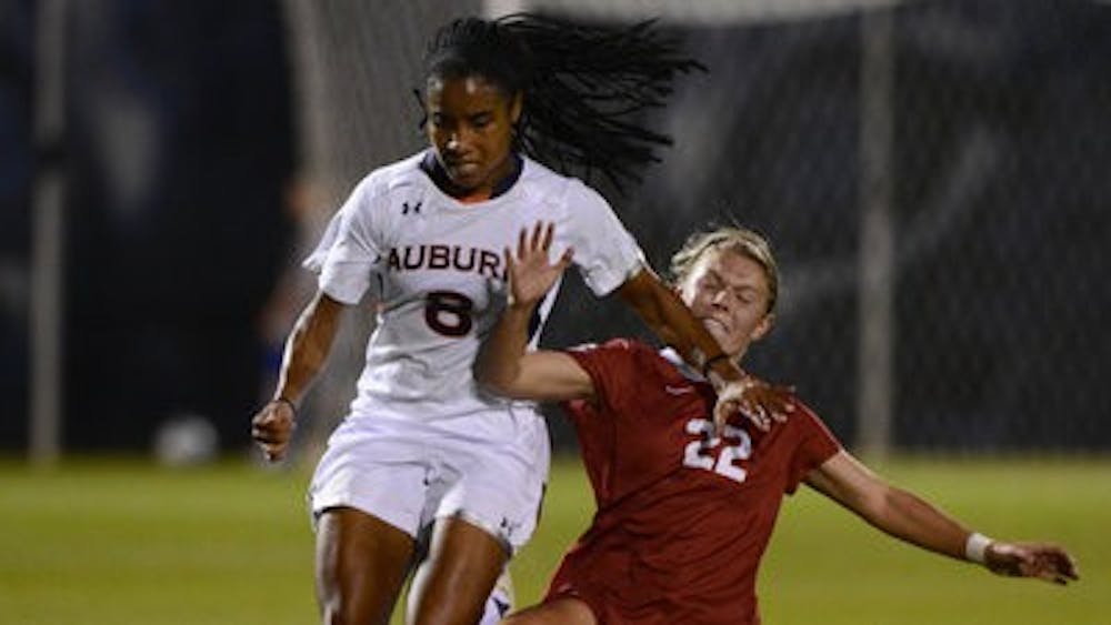 Kim Spence fighting for the ball against Alabama. (Contributed by Auburn Athletics)