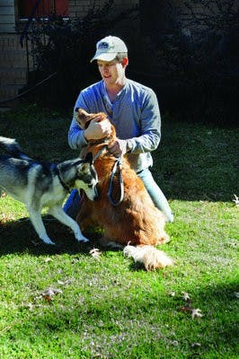 U.S. Navy veteran Bill Key  served in the military for 20 years working on strategic missile submarines. After 19 patrols, he now enjoys his retirement by spending time doing things like playing with dogs Sumi and Max. (Christen Harned / ASSISTANT PHOTO EDITOR)