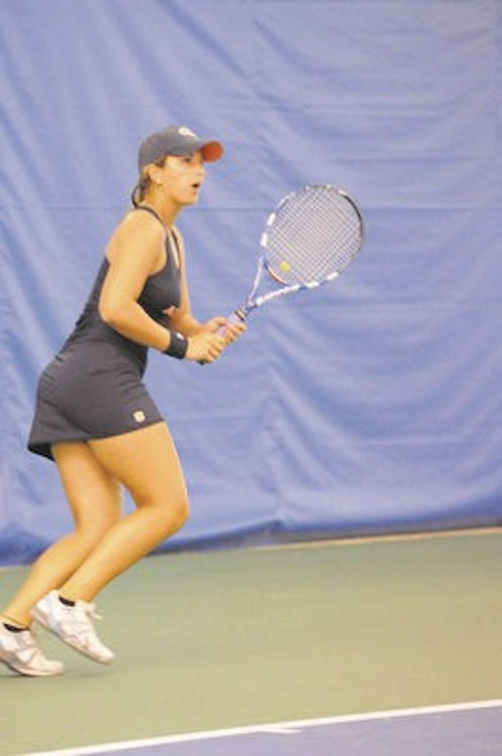 <p>Olivia Bennett, a freshman on the women's tennis team, readies her racket at the tennis tournament Sunday. (File Photo)</p>