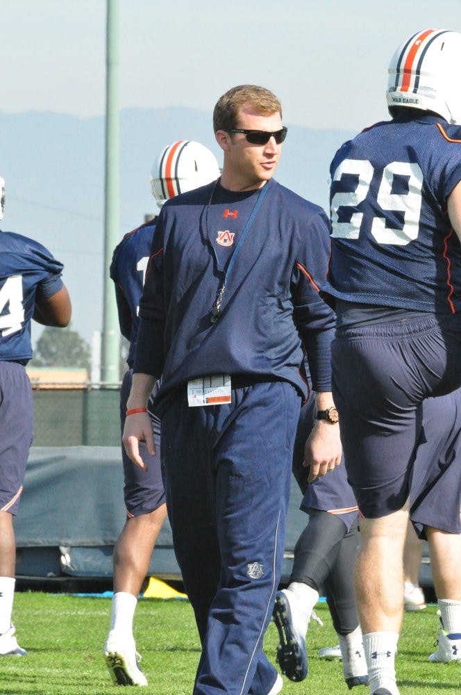 Offensive coordinator Rhett Lashlee watches as players go through drills at the University of California Irvine on Friday Jan. 3. (FILE PHOTO)