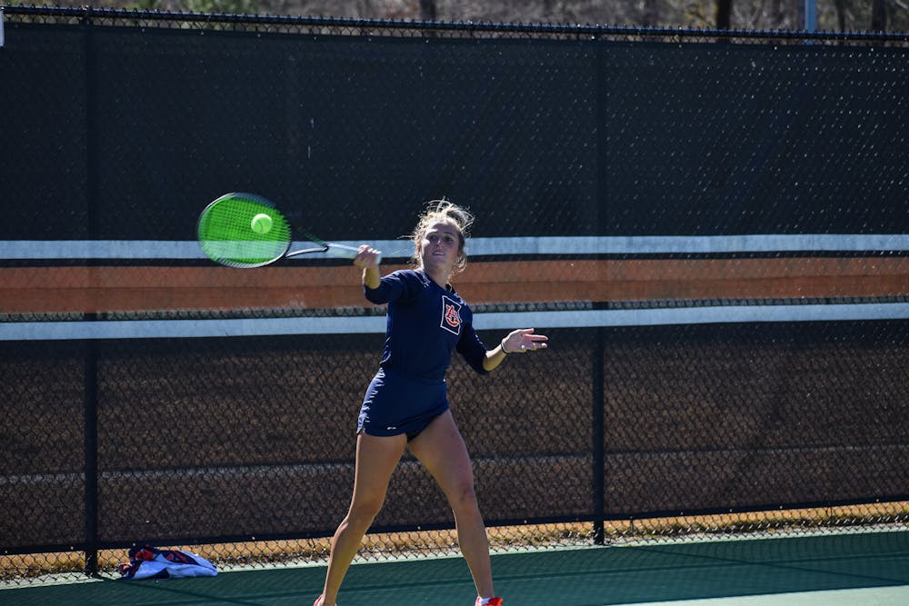 <p>February 6, 2022; Auburn, Alabama; Carolyn Ansari strikes a ball in a match between Auburn and Clemson at the Yarbrough Tennis Center.</p>
