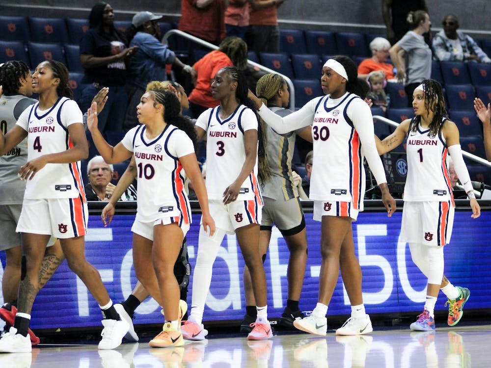 The Auburn Women's Basketball team high fives Alabama state after Auburn wins the game at Neville Arena in Auburn, Ala. on Nov. 8, 2025.