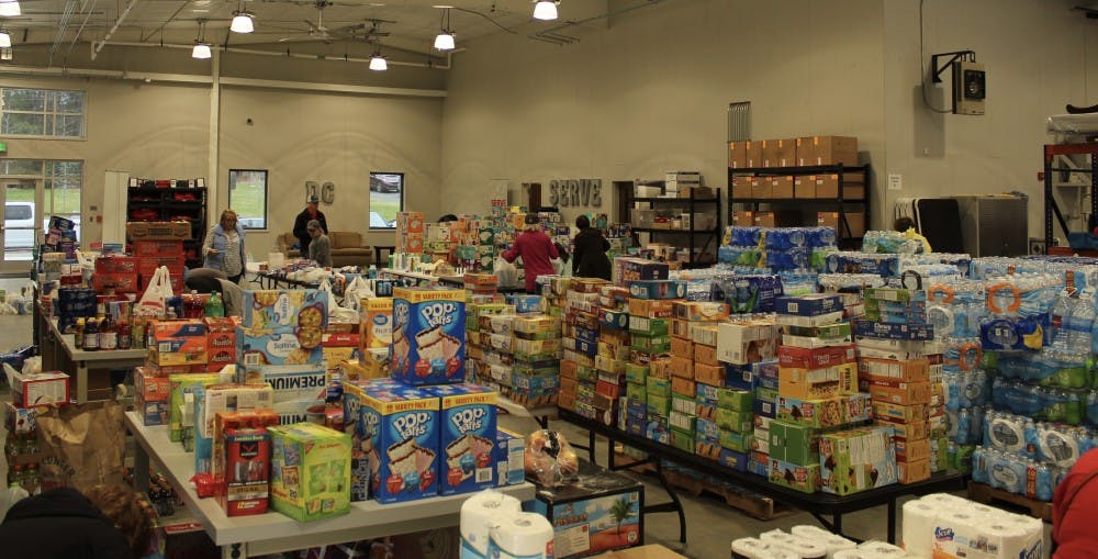 Volunteers at the Auburn Dream Center take donations for tornado victims on March 4, 2019, in Auburn, Ala.