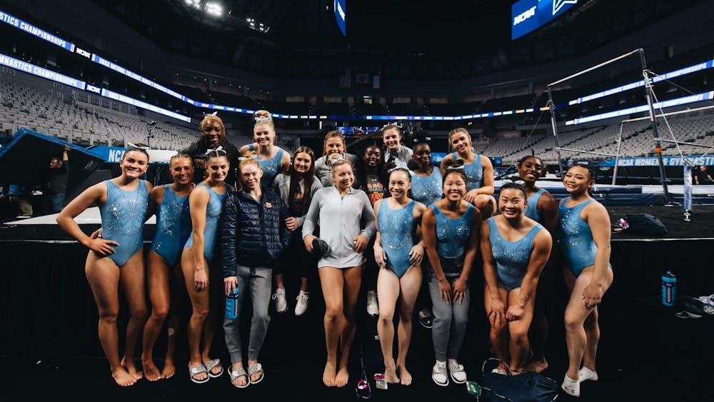 <p>Auburn gymnasts take a team picture after their first round of practice in Fort Worth, Texas on April 13, 2022.&nbsp;</p>
