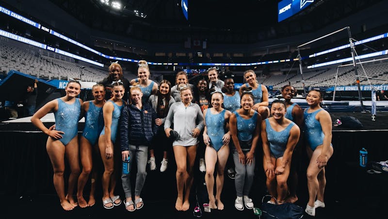 Auburn gymnasts take a team picture after their first round of practice in Fort Worth, Texas on April 13, 2022.&nbsp;