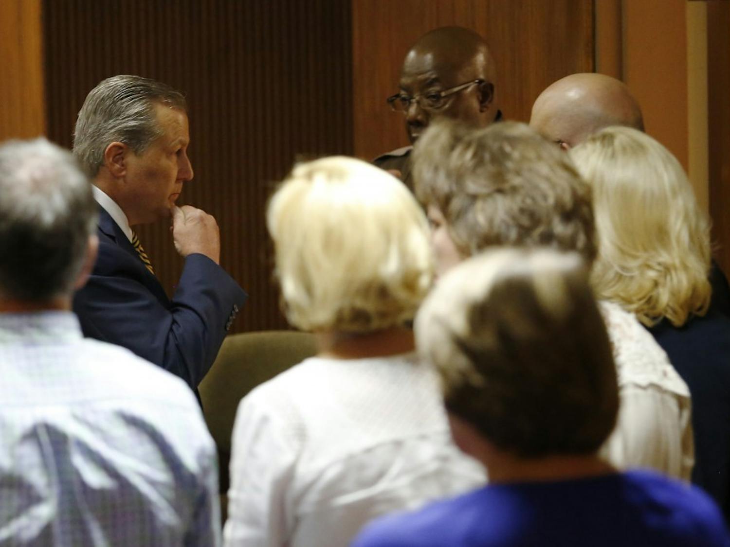 Mike Hubbard looks over at his wife Susan Hubbard while Lee County sheriffs deputies wait to take Hubbard into custody after found guilty on 12 of 23 counts on Friday, June 10, 2016  in Opelika, Ala. 
Todd J. Van Emst/Opelika-Auburn News/Pool